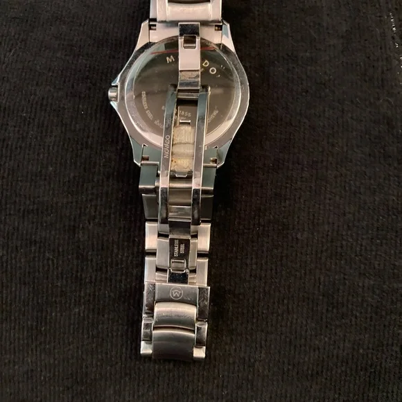 Movado men masino blue, light ware on bezel crystal is in great shape watch